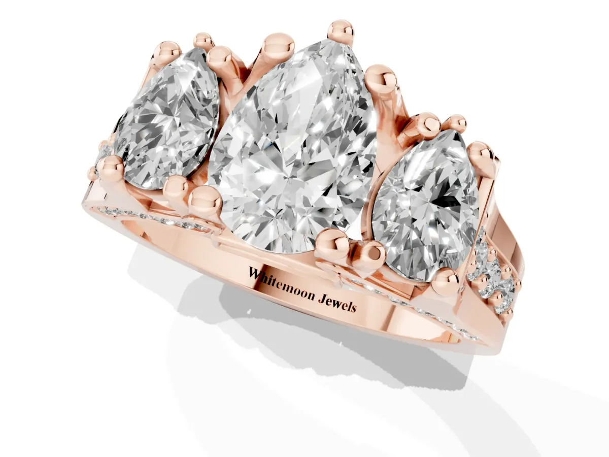 Pear Cut Diamond Three-Stone Ring with Channel Set Band and Four-Prong Setting Rose gold