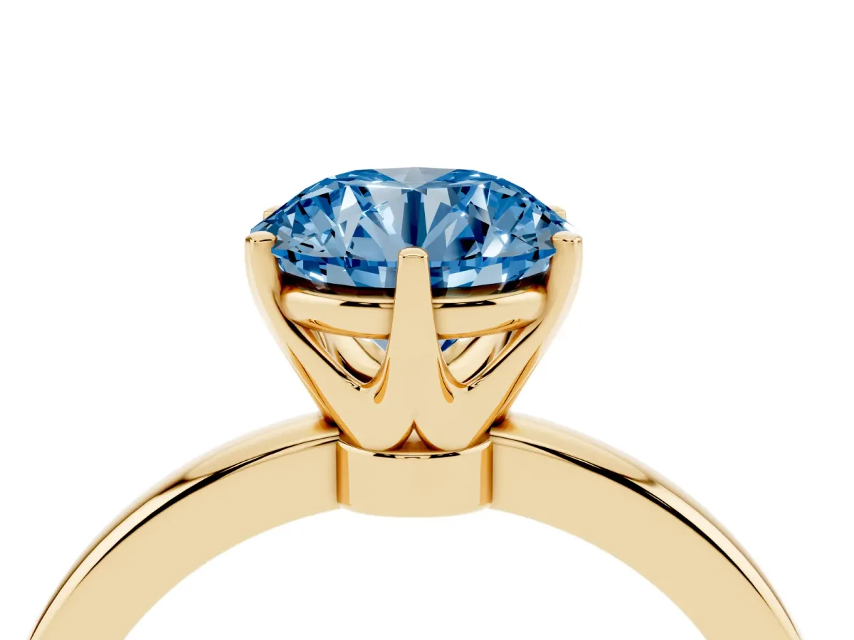 Fancy Blue Round Cut Solitaire Diamond Ring with Six-Prong Setting on a Classic Band Yellow gold