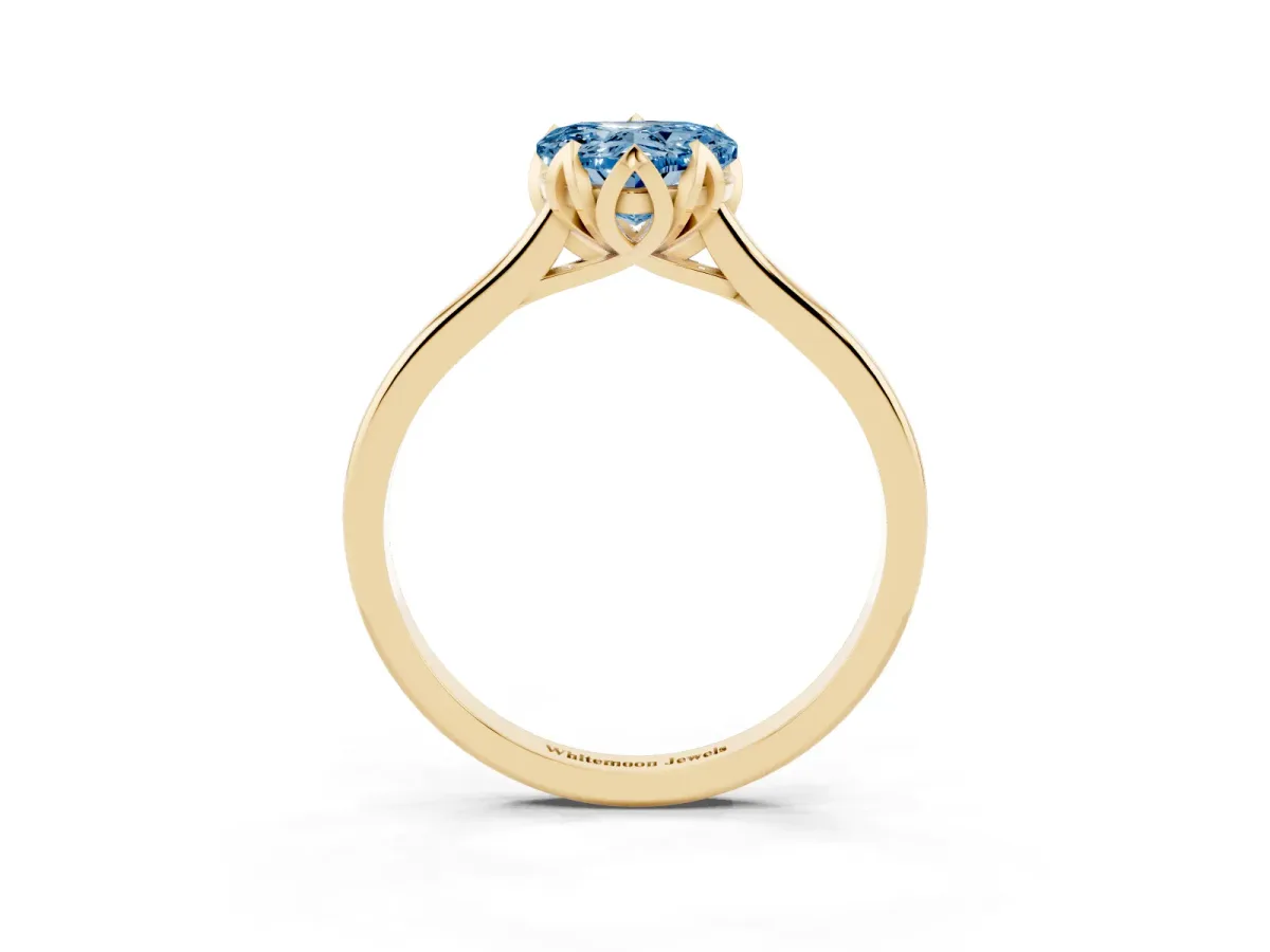 Fancy Blue Heart Cut Diamond Solitaire Ring with Flower Prong Setting and Classic Band Yellow gold