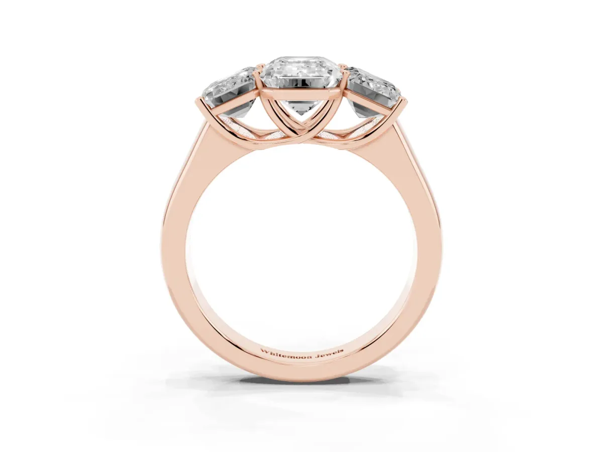 Emerald Cut Three-Stone Diamond Ring with Prong Setting on a Classic Band Rose gold