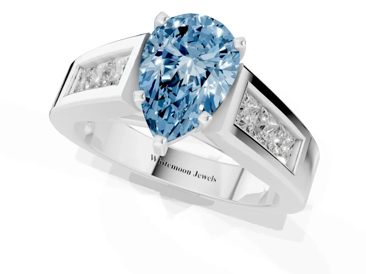 Fancy Blue Pear Cut Cut Channel Set Solitaire Ring with Four-Prong Setting Platinum