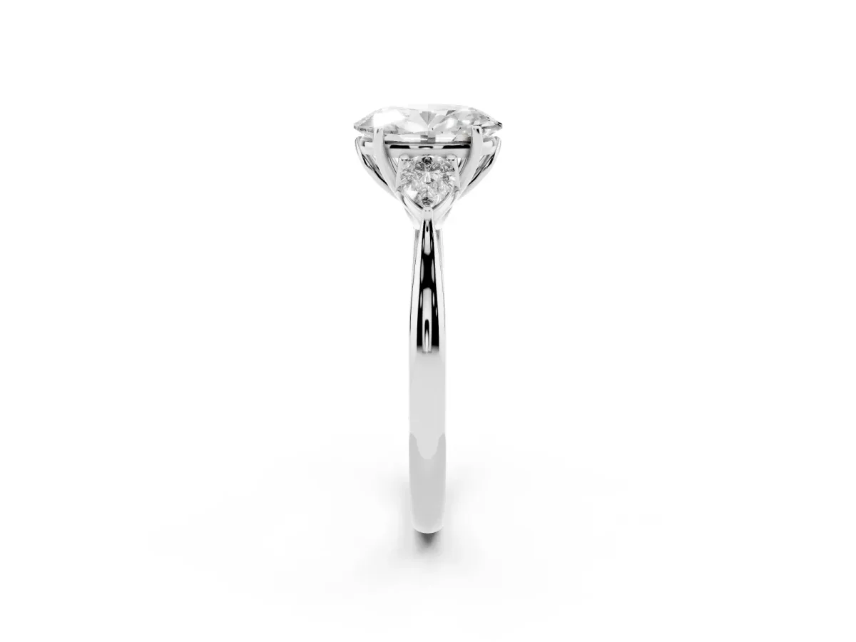 Three-Stone Oval Cut Diamond Ring with Pear Side Stones in Four-Prong Setting Platinum