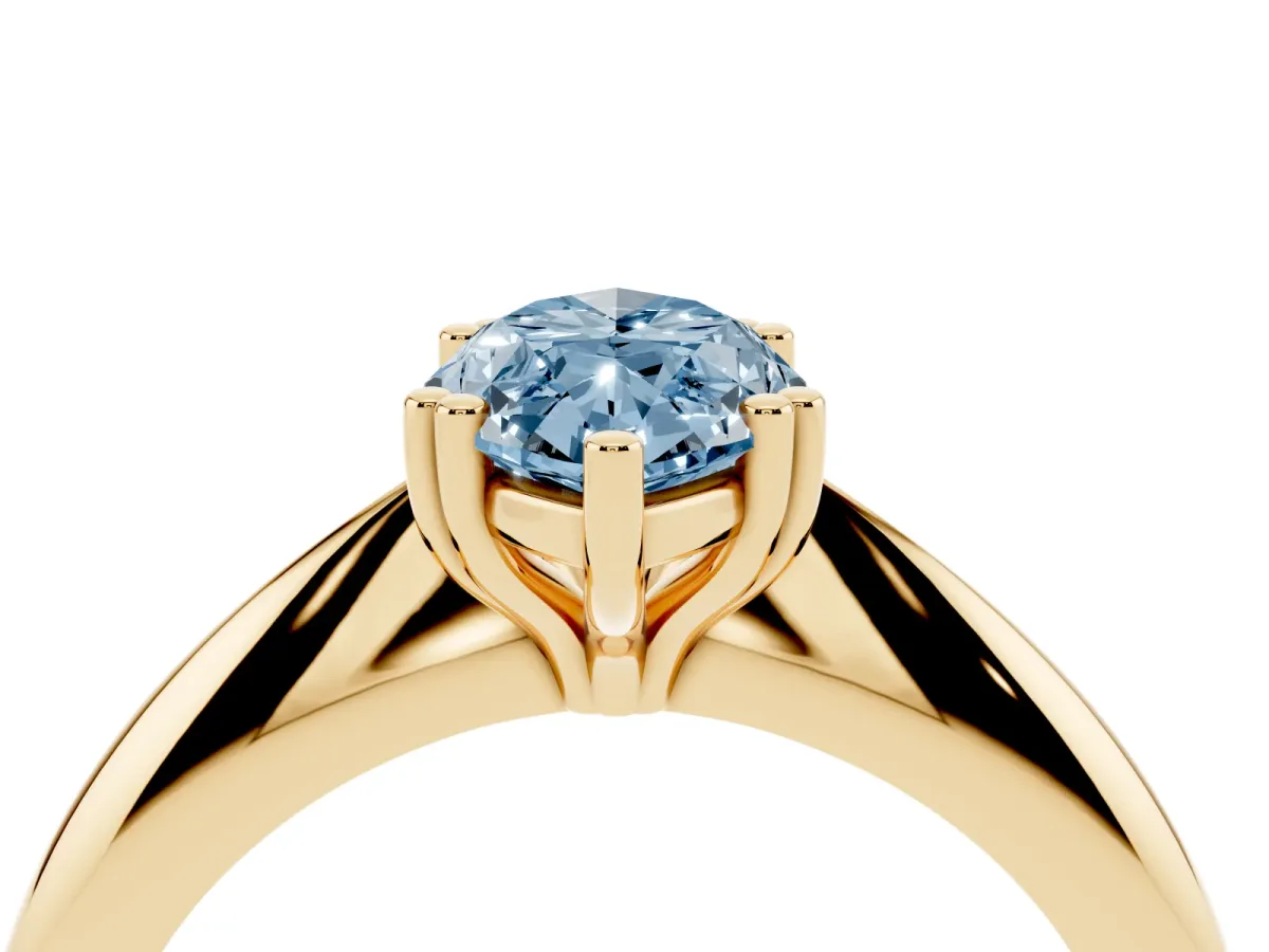 Fancy Blue Marquise Cut Cut Solitaire Engagement Ring with Tapered Band and Four-Prong Setting Yellow gold