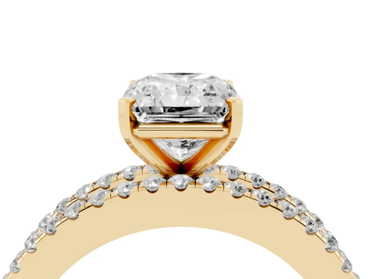 Radiant Cut Diamond Solitaire Ring with Pavé and Channel Set Band Yellow gold