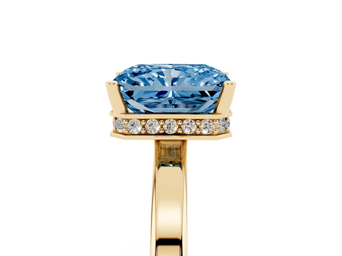 Fancy Blue Radiant Cut Cut Solitaire Engagement Ring with Four-Prong Setting on a Classic Band Yellow gold