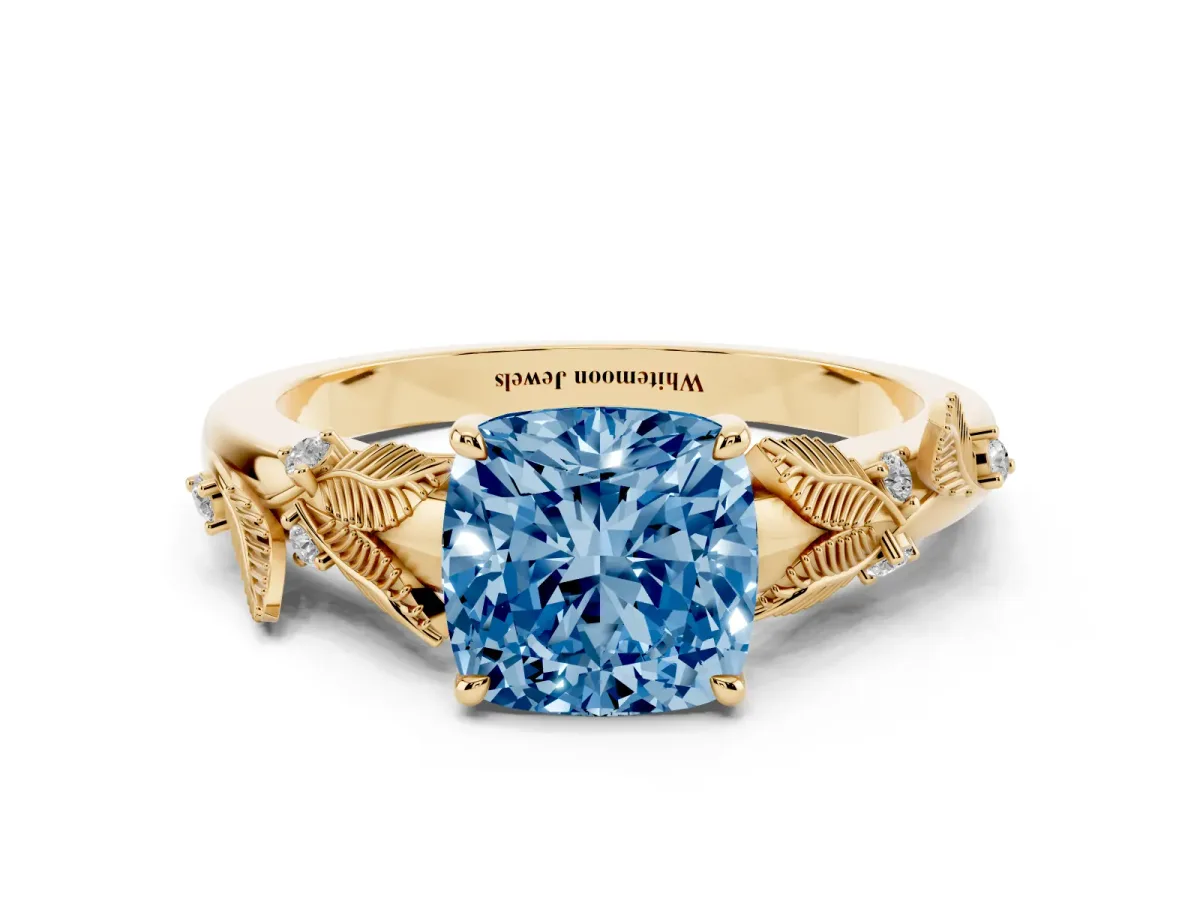 Fancy Blue Cushion Cut Diamond Solitaire Ring with Leaf Motif Band and Four-Prong Setting Yellow gold