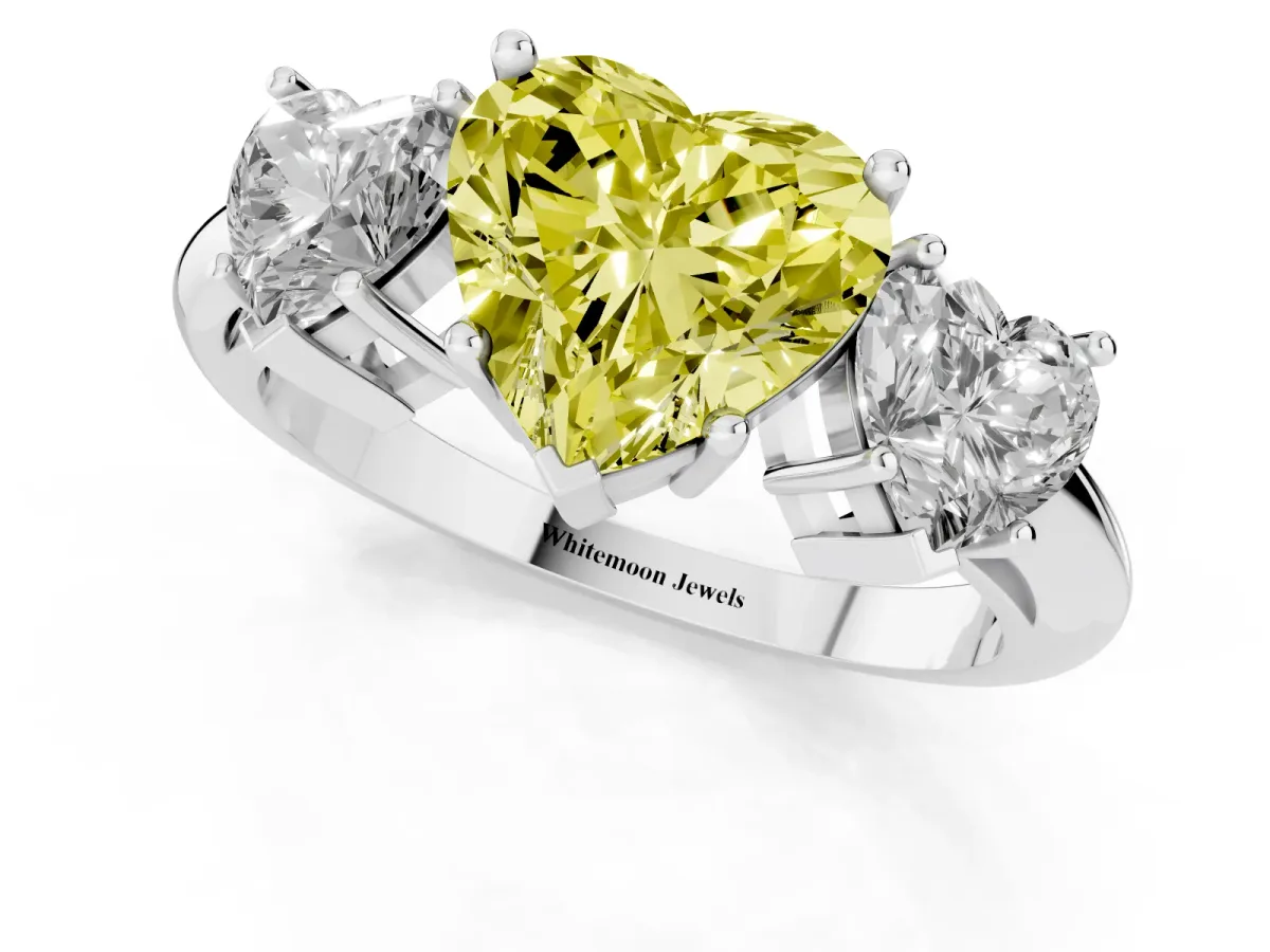 Fancy Yellow Three-Stone Heart Cut Cut Diamond Engagement Ring with Prong Setting on a White Gold Band Silver