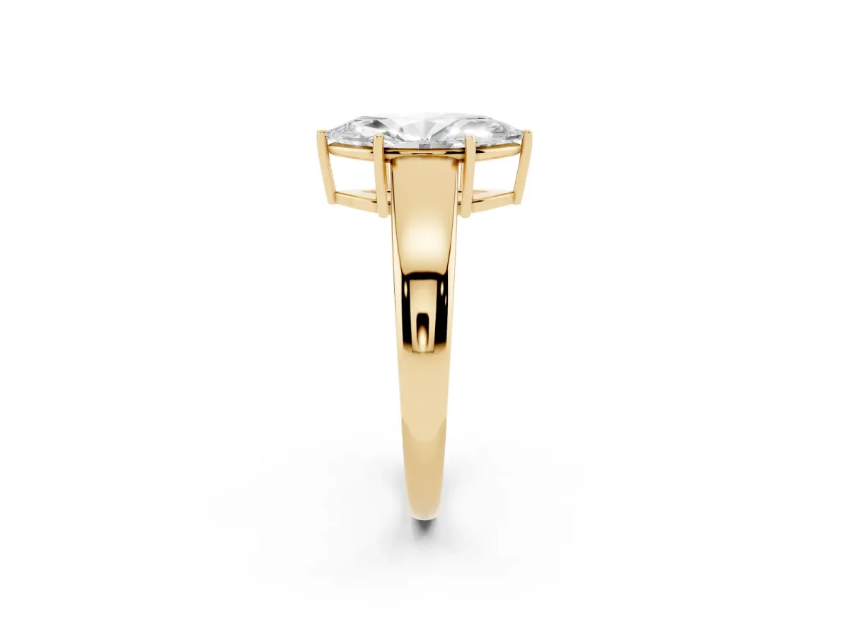 Marquise Cut Solitaire Diamond Ring with Tapered Band and Four-Prong Setting Yellow gold