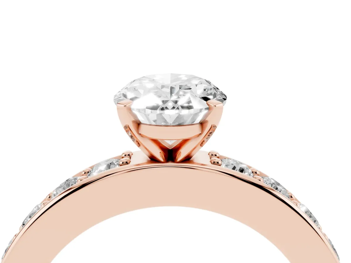 Oval Cut Diamond Engagement Ring with Channel Set Round Band and Prong Setting Rose gold