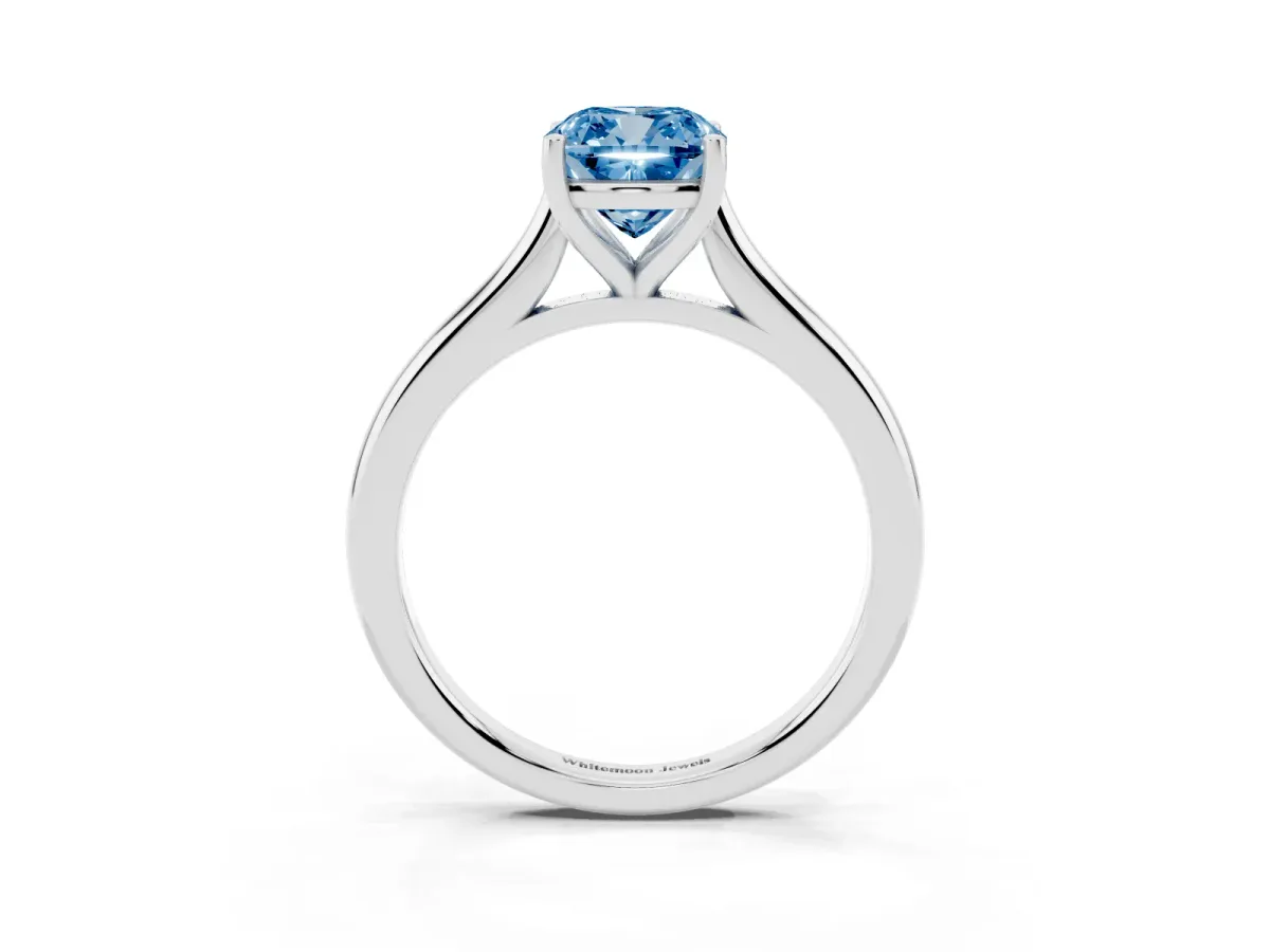 Fancy Blue Cushion Cut Cut Solitaire Ring with Cathedral Band and Four-Prong Setting Silver