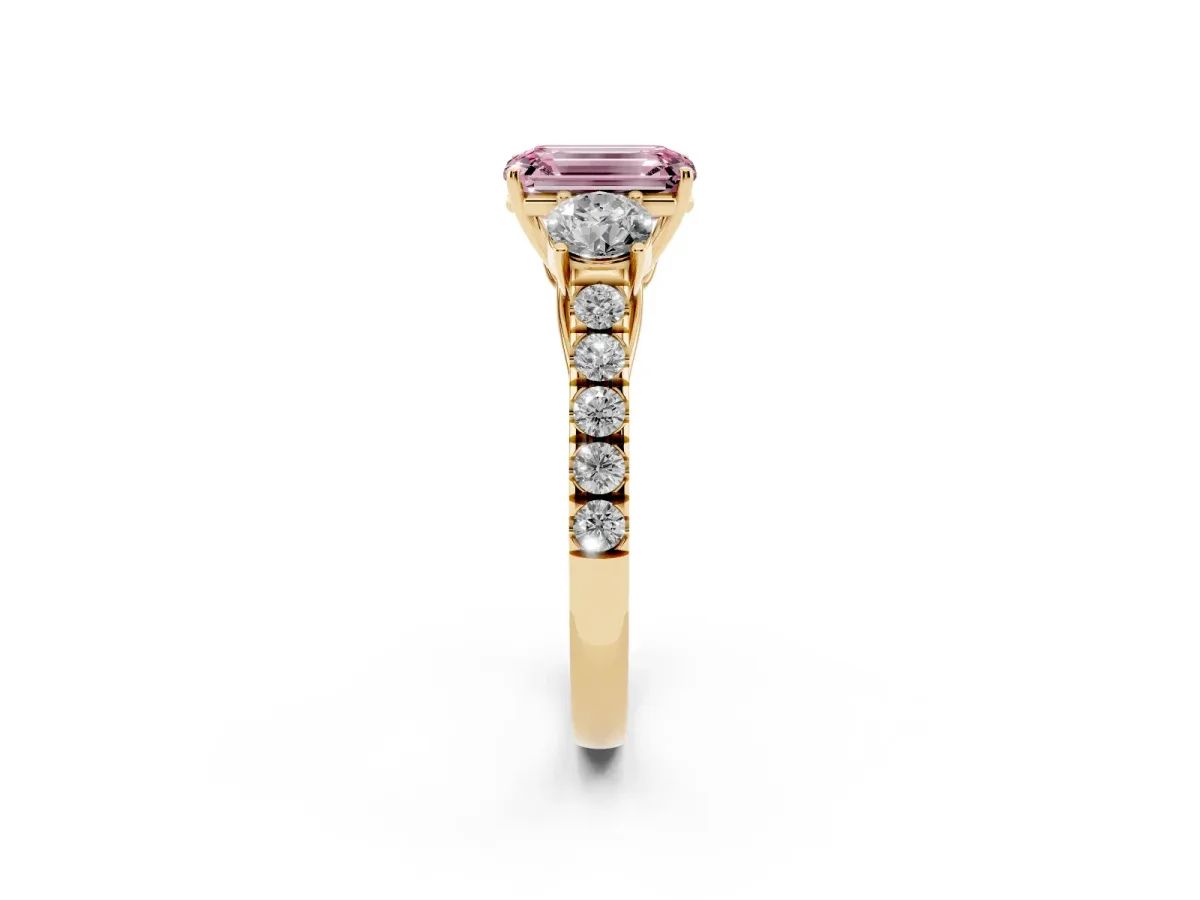 Fancy Pink Emerald Cut Cut Diamond Three-Stone Ring with Round Side Stones and Pavé Band Yellow gold