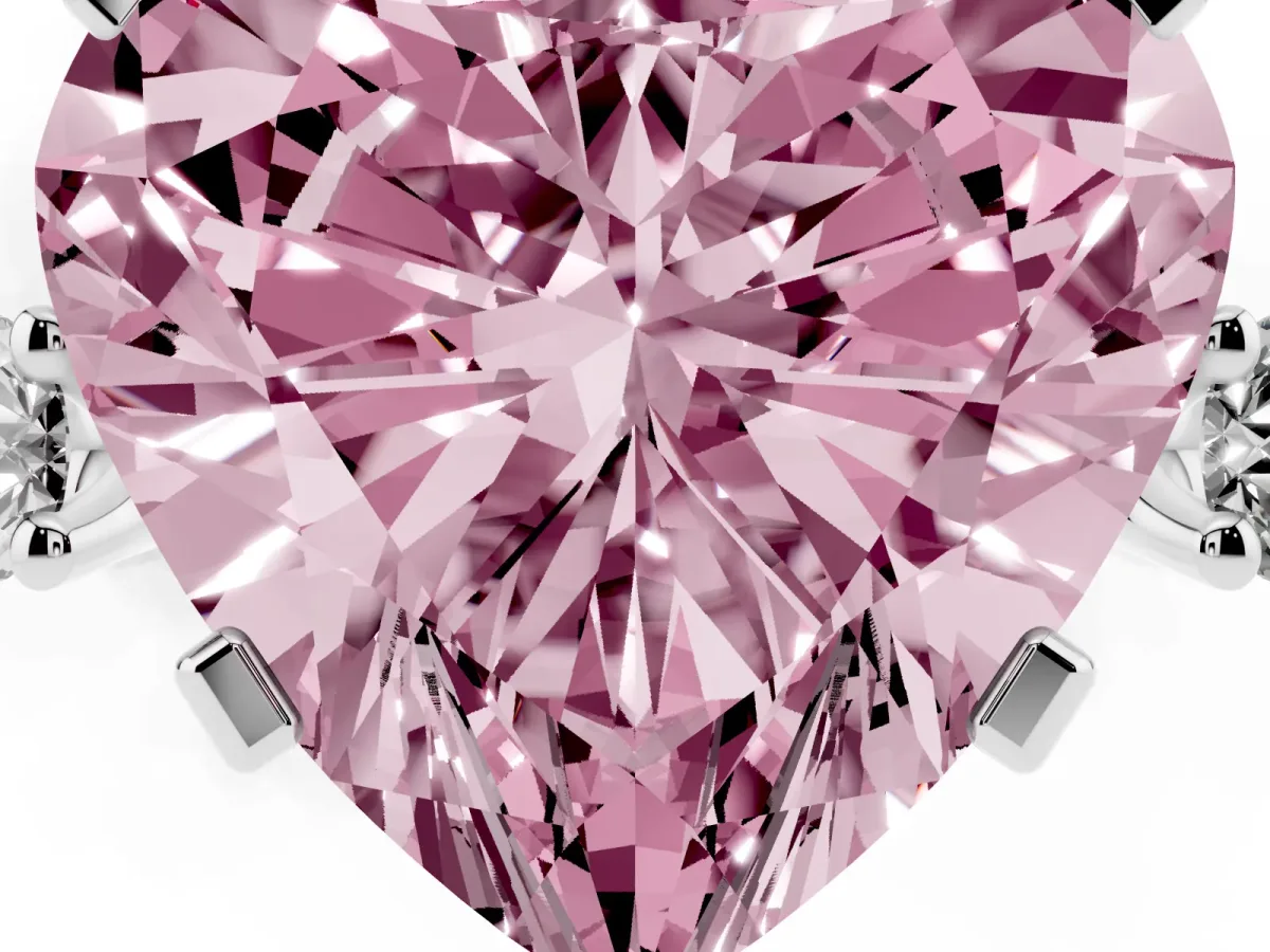 Fancy Pink Heart Cut Cut Three-Stone Solitaire Ring with Round Accent Diamonds and Four-Prong Setting Silver