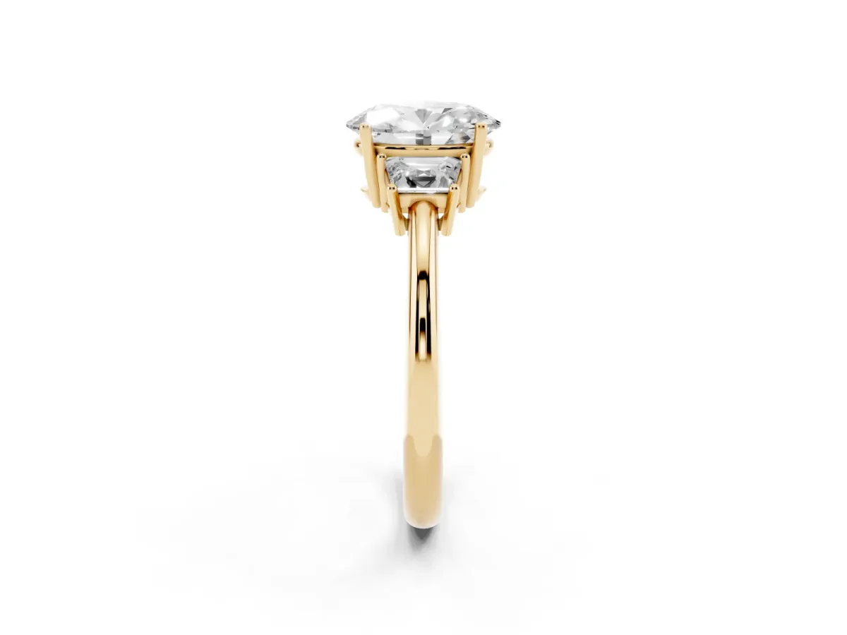 Oval Cut Diamond Three-Stone Ring with Trapezoid Side Stones and Prong Setting Yellow gold