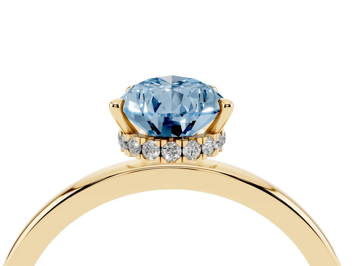 Fancy Blue Pear Cut Solitaire Engagement Ring with Cathedral Band and Four-Prong Setting Yellow gold
