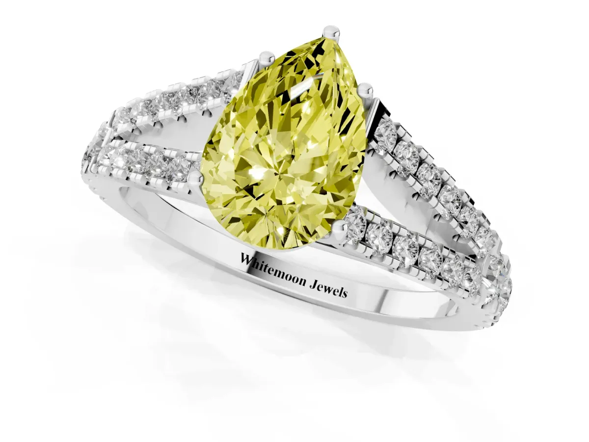 Fancy Yellow Pear Cut Diamond Split Shank Engagement Ring with Round Pavé and Prong Setting Platinum