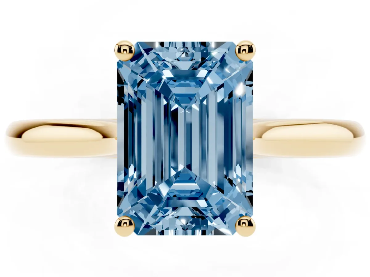 Fancy Blue Emerald Cut Cut Solitaire Ring with Cathedral Band and Four-Prong Setting Yellow gold