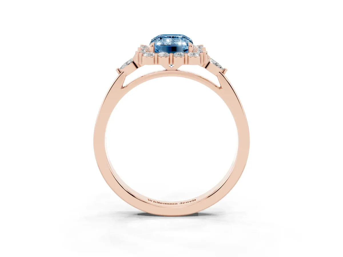 Fancy Blue Emerald Cut Diamond Halo Ring with Pear Side Stones and Prong Setting Rose gold
