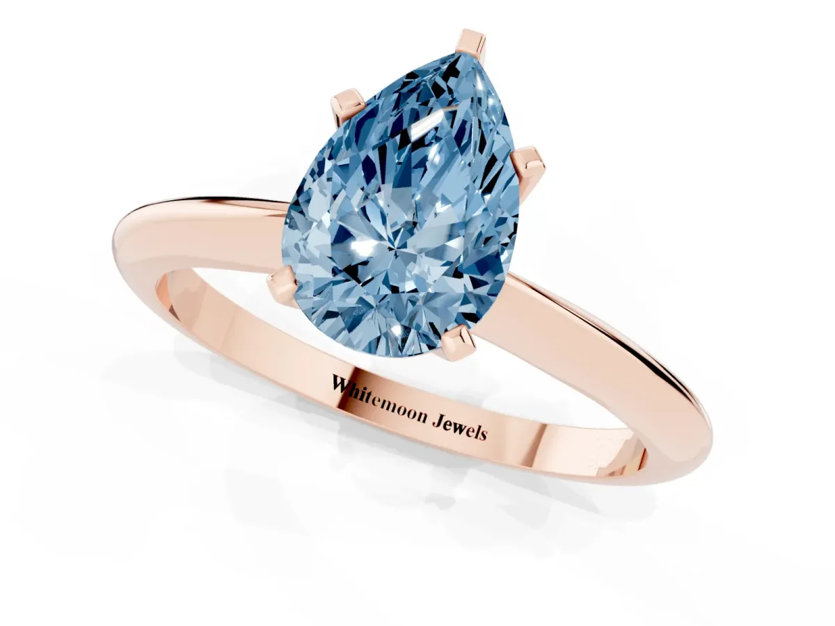 Fancy Blue Pear Cut Cut Solitaire Ring with Four-Prong Setting on a Classic Band Rose gold