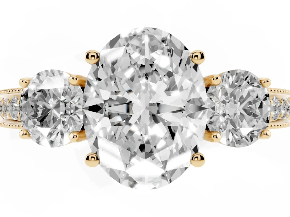 Oval Cut Three-Stone Diamond Ring with Pavé Band and Four-Prong Setting Yellow gold
