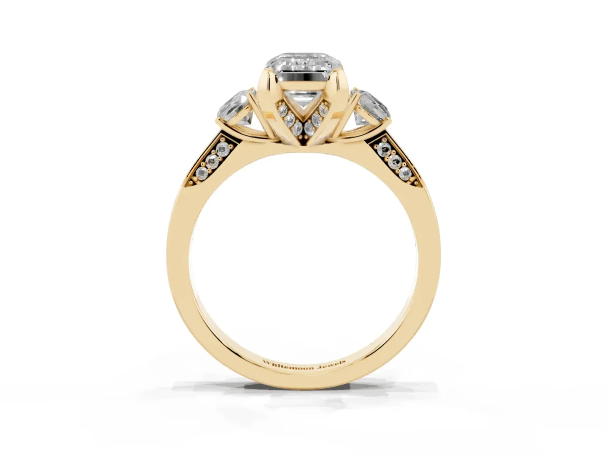 Fancy Blue Emerald Cut Brilliant Three-Stone Diamond Ring with Pavé Band and Four-Prong Setting Yellow gold