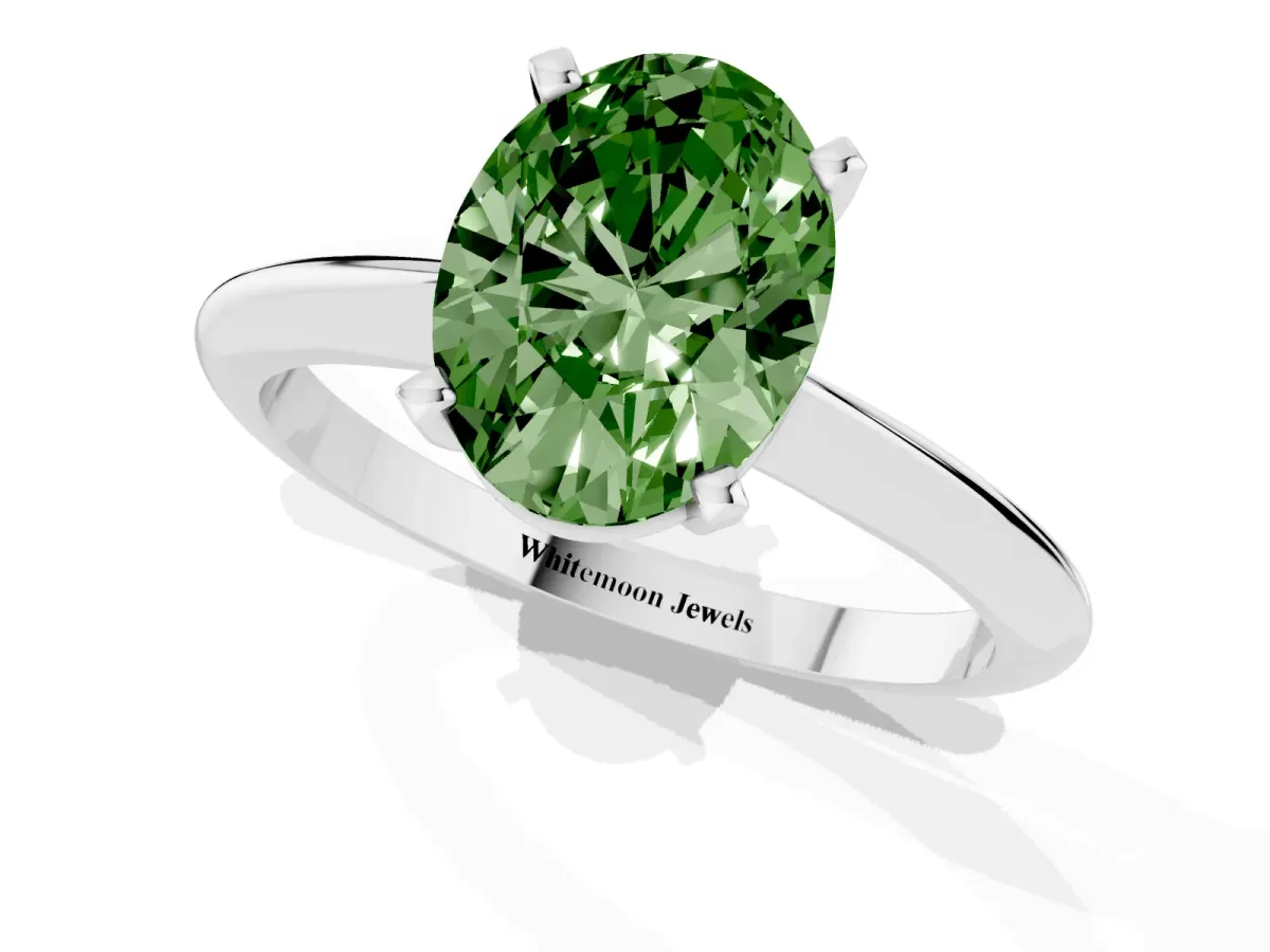 Fancy Green Oval Cut Cut Solitaire Ring with Four-Prong Setting on a Classic Band Silver