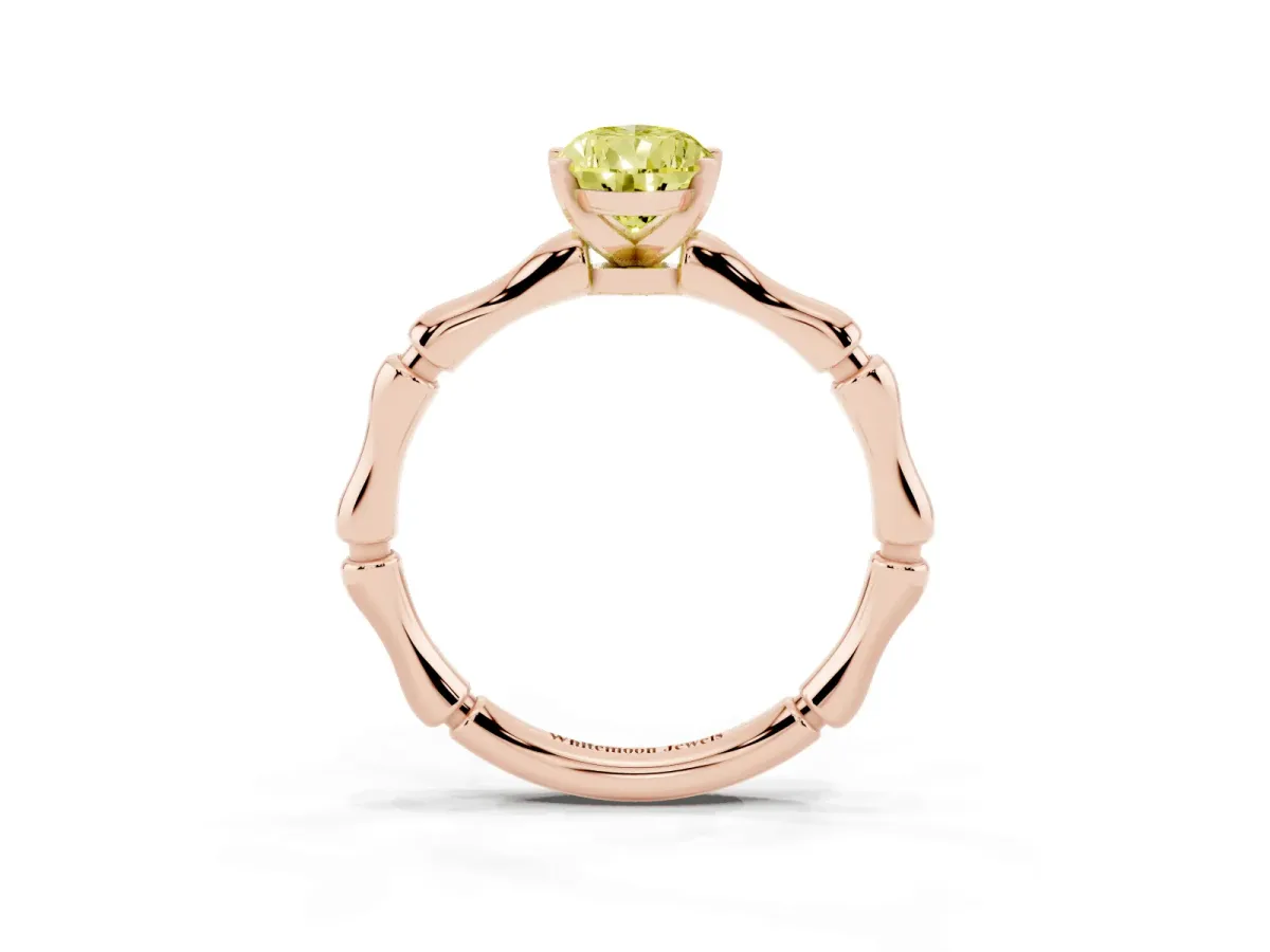 Fancy Yellow Pear Cut Solitaire Diamond Ring with Bamboo Band and Four-Prong Setting Rose gold