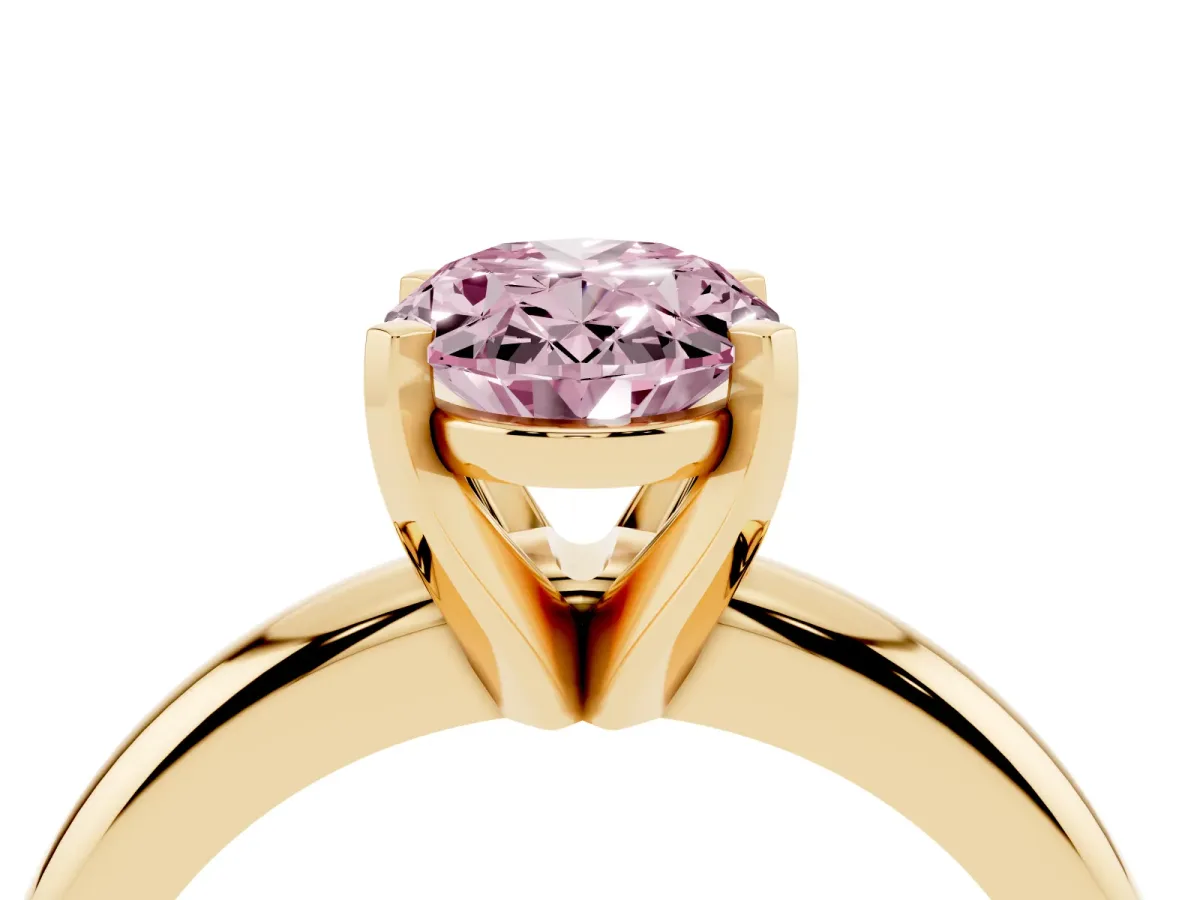 Fancy Pink Oval Cut Diamond Solitaire Engagement Ring with Round Band and Four-Prong Setting Yellow gold