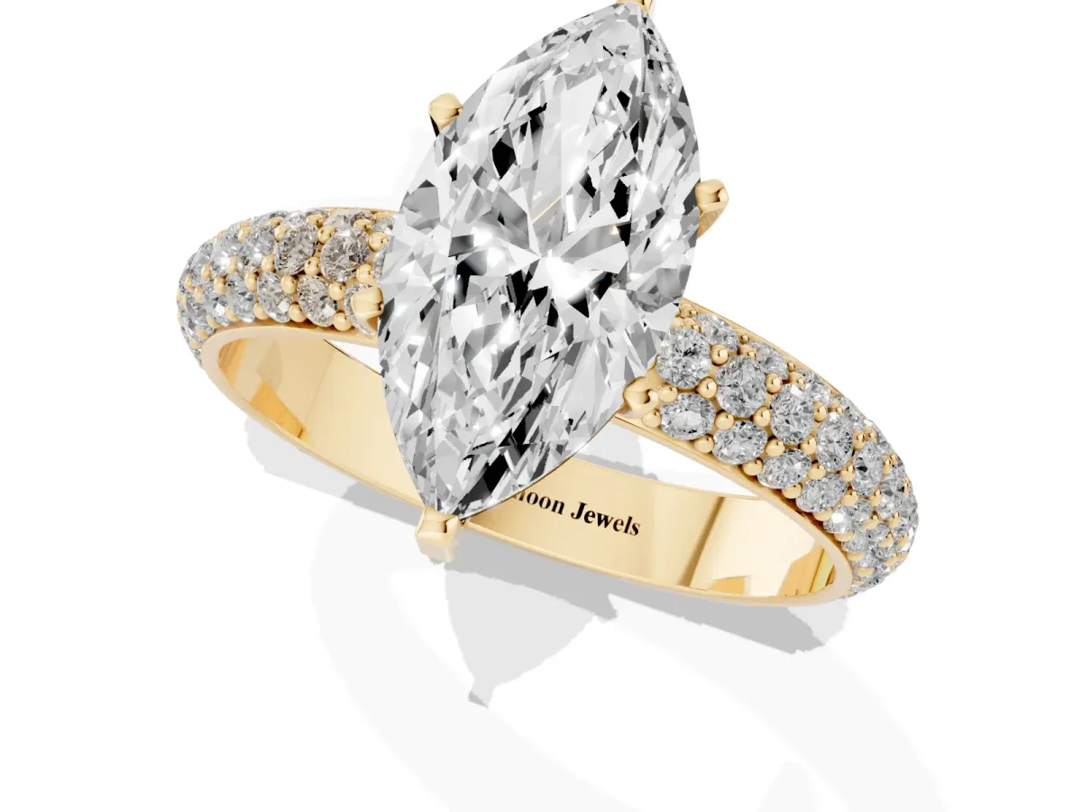 Marquise Cut Diamond Solitaire Ring with Prong Setting and Pavé Band Yellow gold