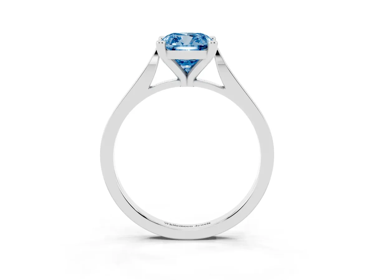 Fancy Blue Cushion Cut Solitaire Diamond Ring with Four-Prong Setting and Tapered Band Platinum