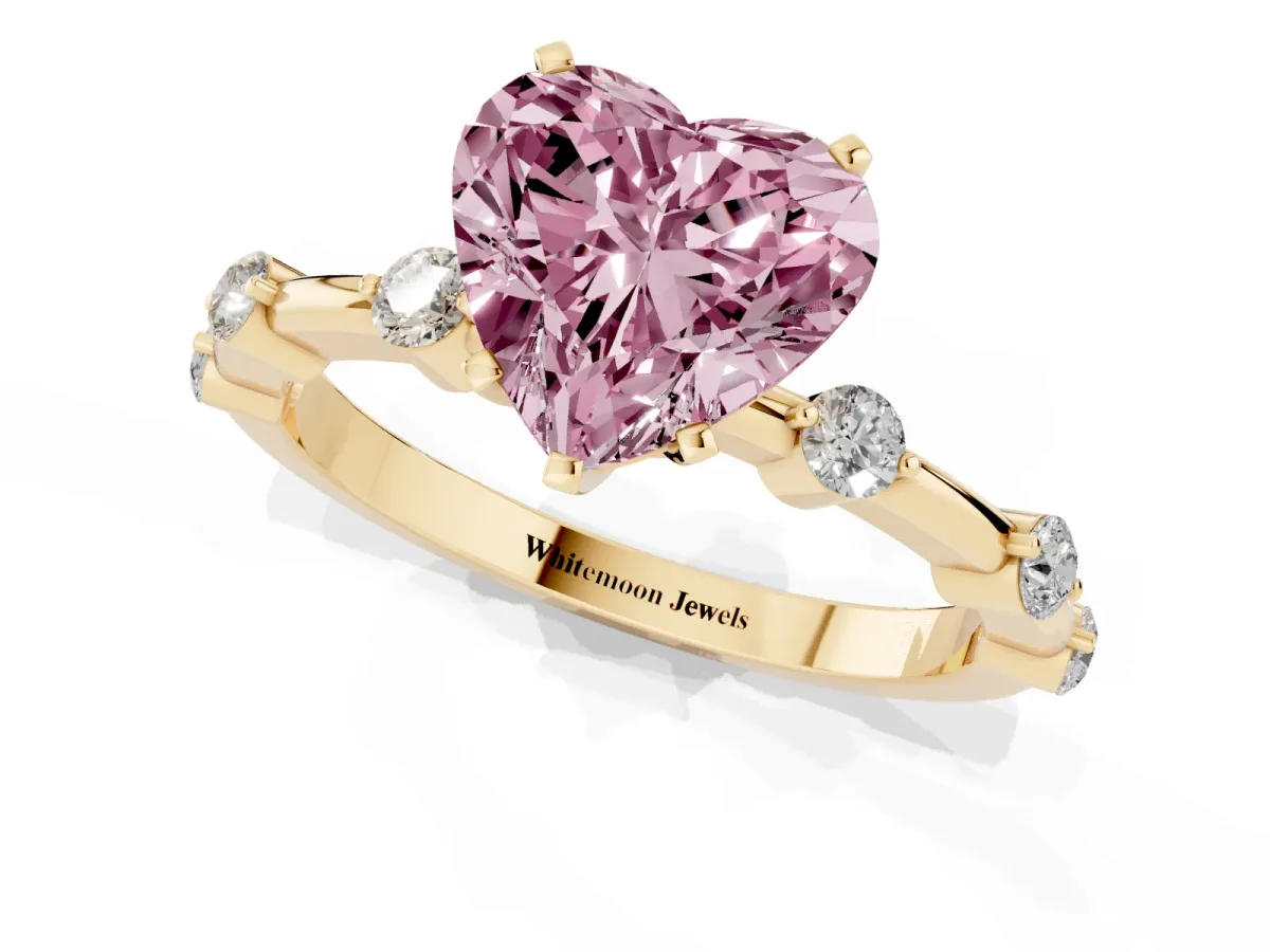 Fancy Pink Heart Cut Solitaire Diamond Ring with Bezel Set Side Stones and Prong Setting Yellow gold