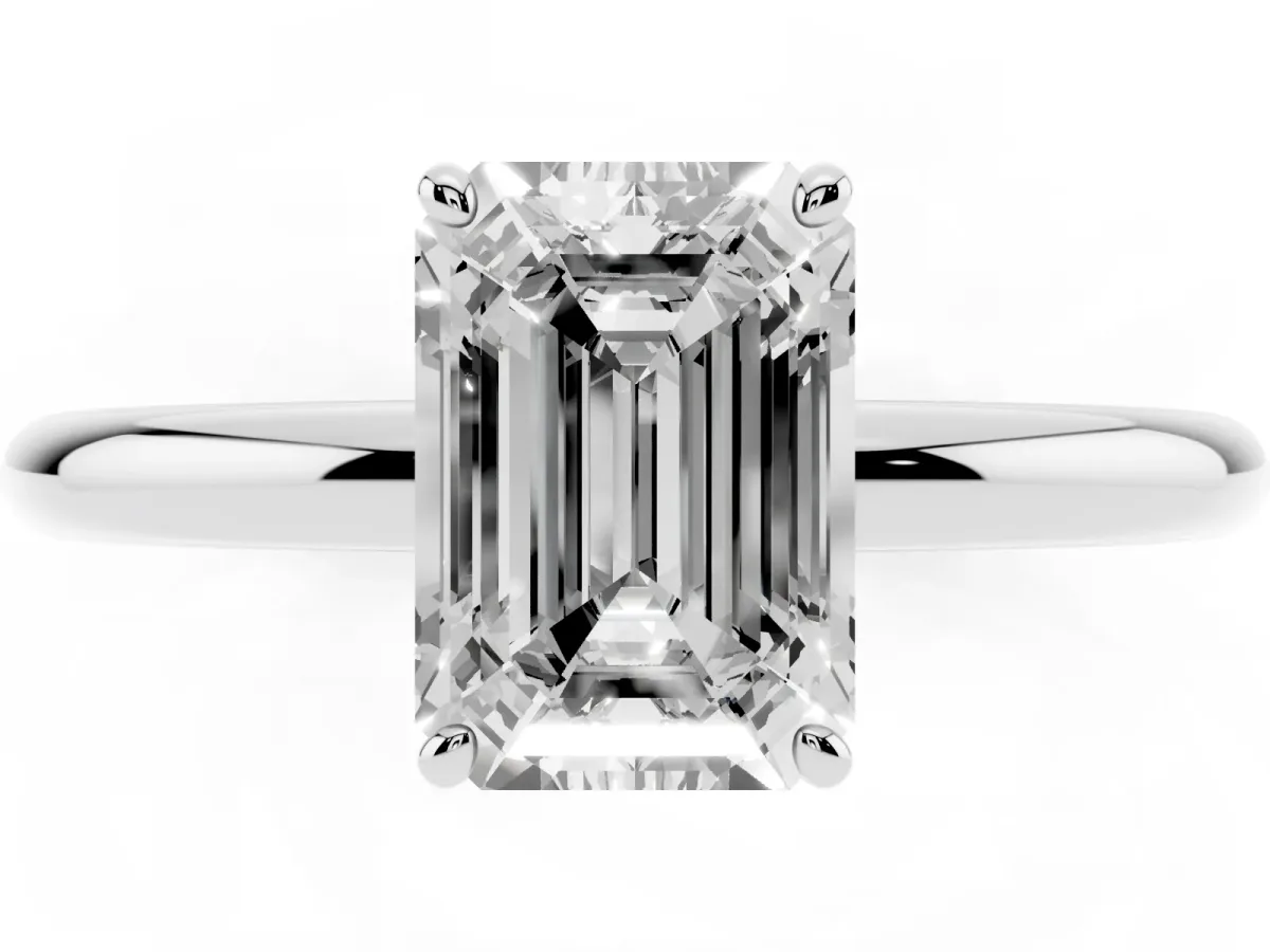Emerald Cut Solitaire Diamond Ring with Four-Prong Setting on a Plain Band Platinum