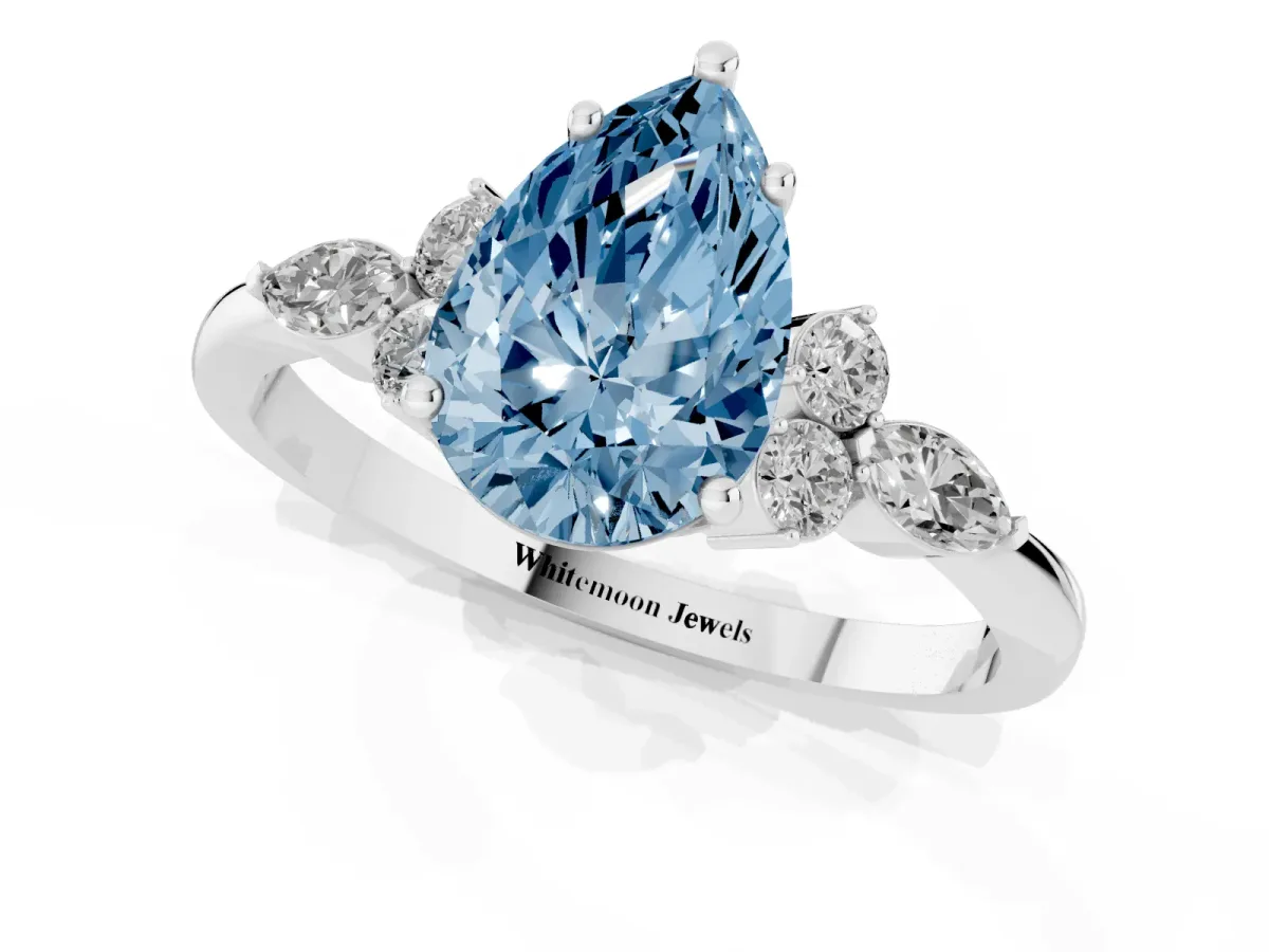 Fancy Blue Pear Cut Brilliant Diamond Solitaire Ring with Pear Side Stones and Four-Prong Setting Silver