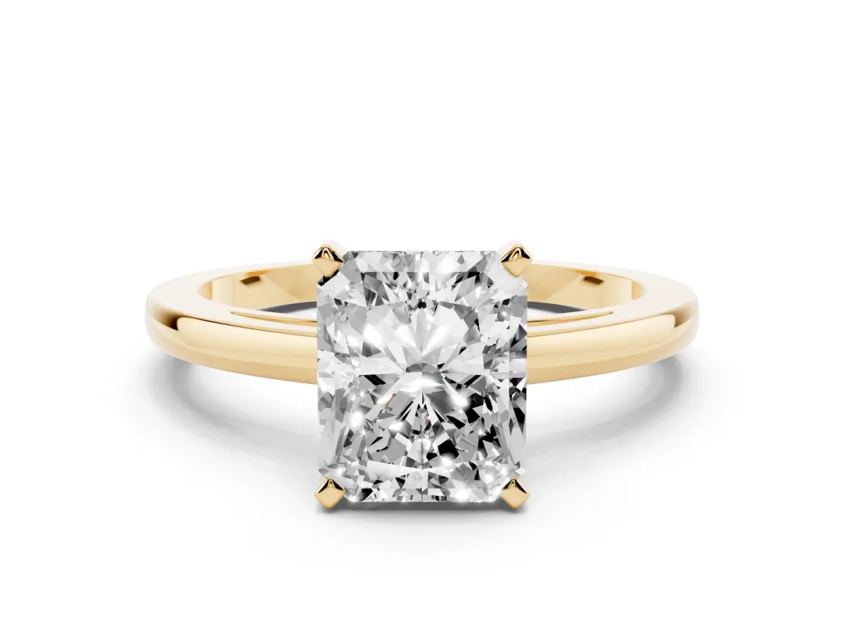 Radiant Cut Solitaire Diamond Engagement Ring with Four-Prong Setting on a Classic Band Yellow gold