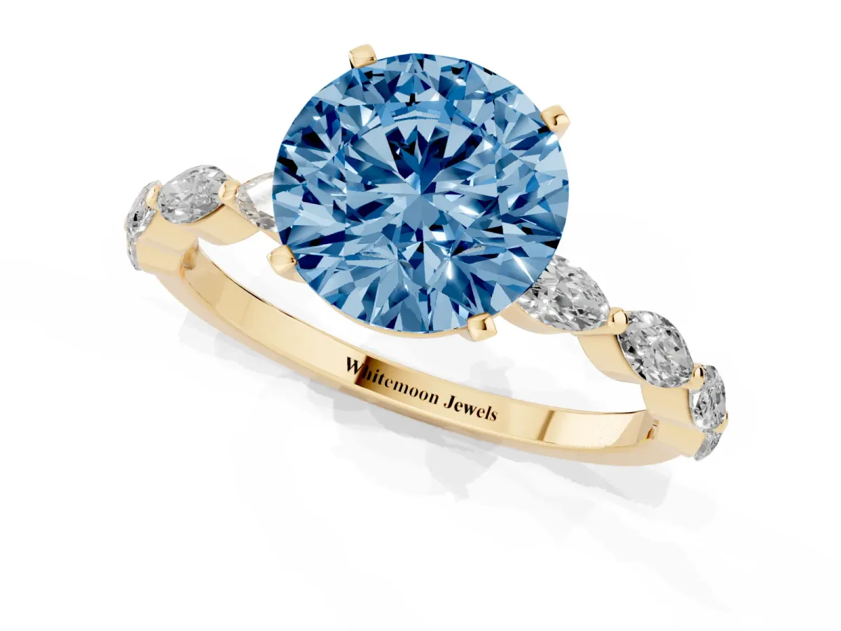 Fancy Blue Round Cut Diamond Ring with Marquise Side Stones and Prong Setting Yellow gold