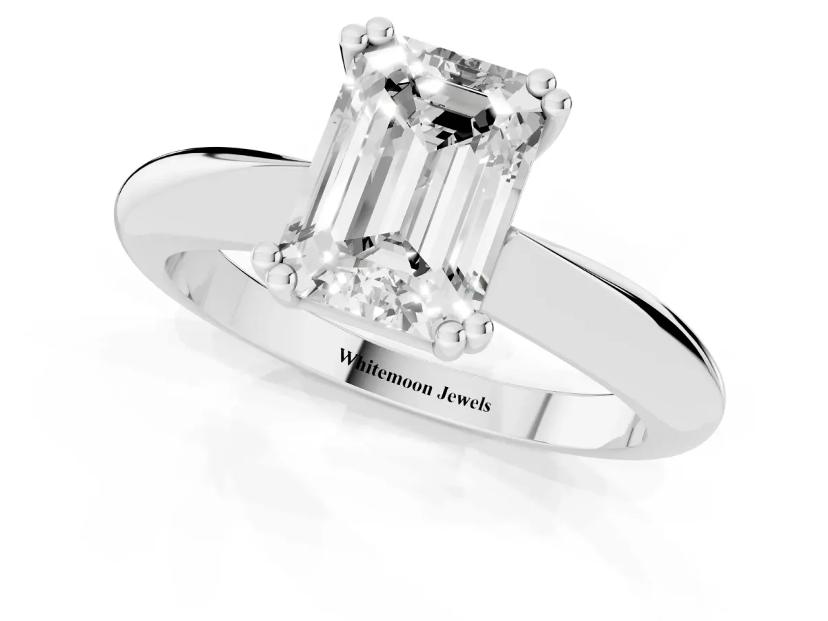 Emerald Cut Cut Solitaire Engagement Ring with Tapered Band and Four-Prong Setting Silver