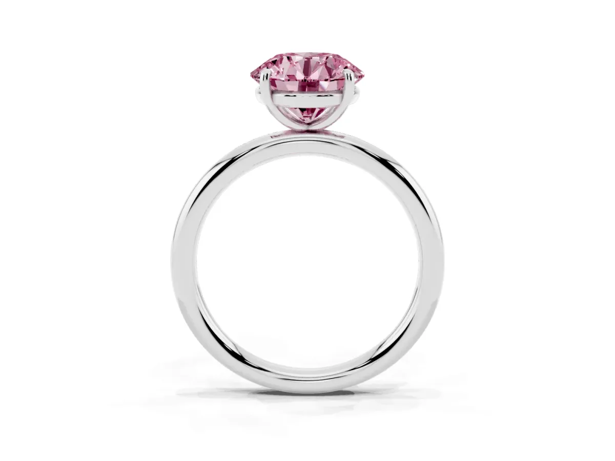 Fancy Pink Round Cut Solitaire Diamond Ring with Four-Prong Setting on a Plain Band Platinum