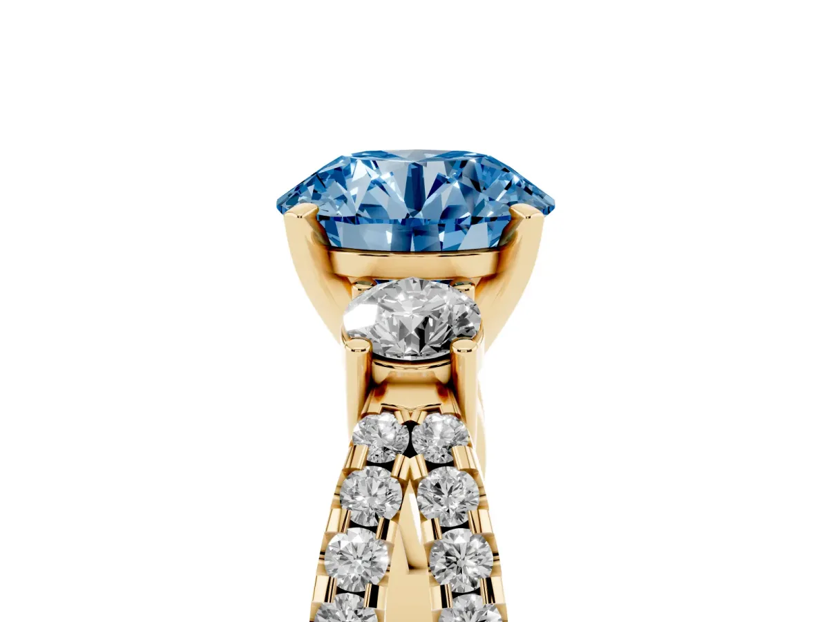 Fancy Blue Round Cut Diamond Three-Stone Ring with Pavé Split Shank and Four-Prong Setting Yellow gold