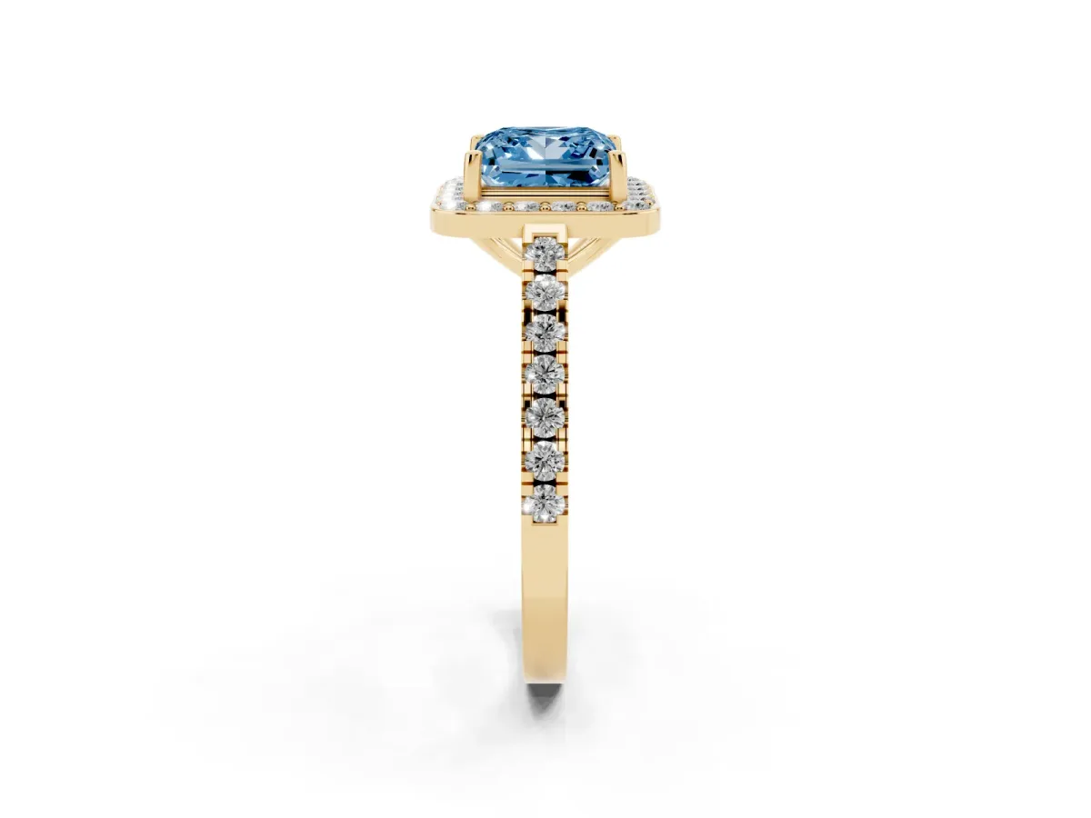Fancy Blue Princess Cut Diamond Halo Ring with Round Pavé Split Shank and Prong Setting Yellow gold