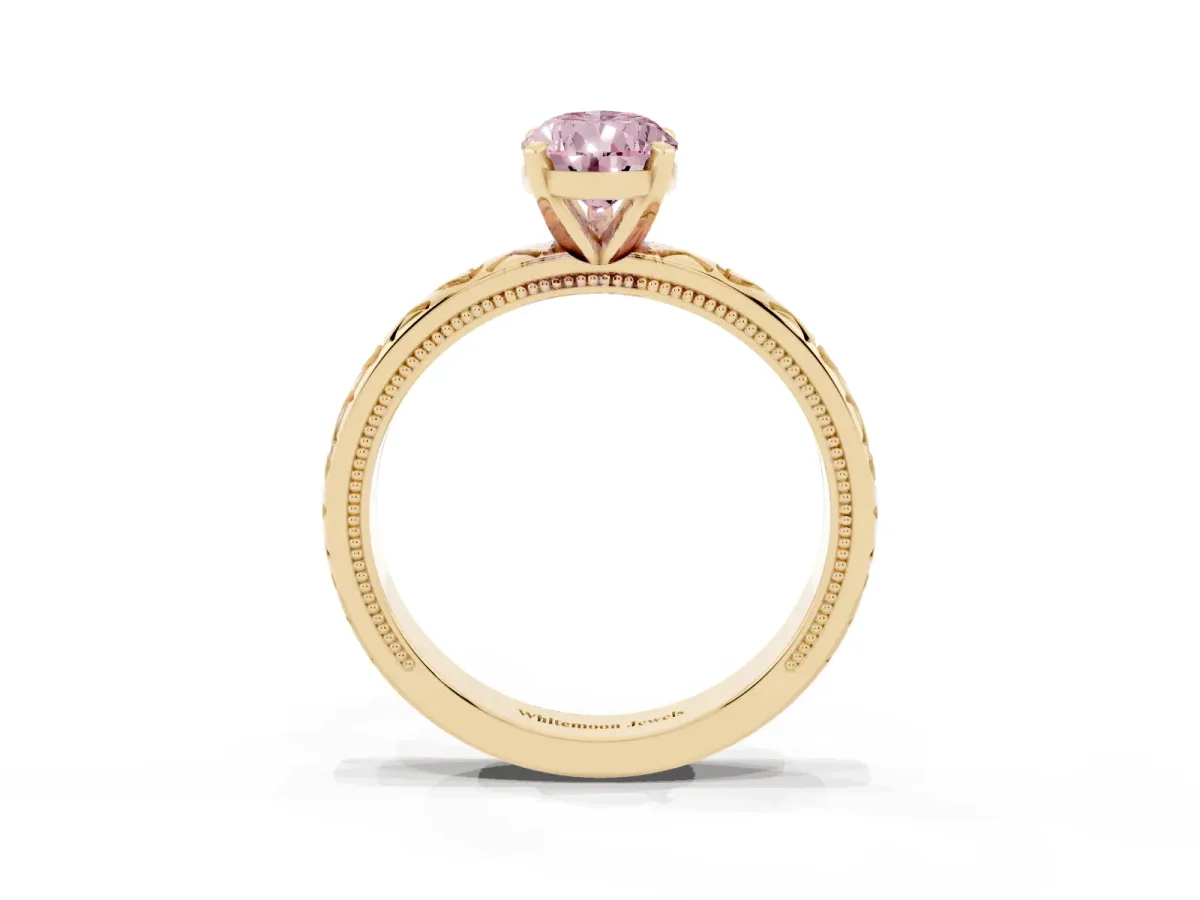 Fancy Pink Pear Cut Solitaire Diamond Engagement Ring with XO Engraved Band and Four-Prong Setting Yellow gold