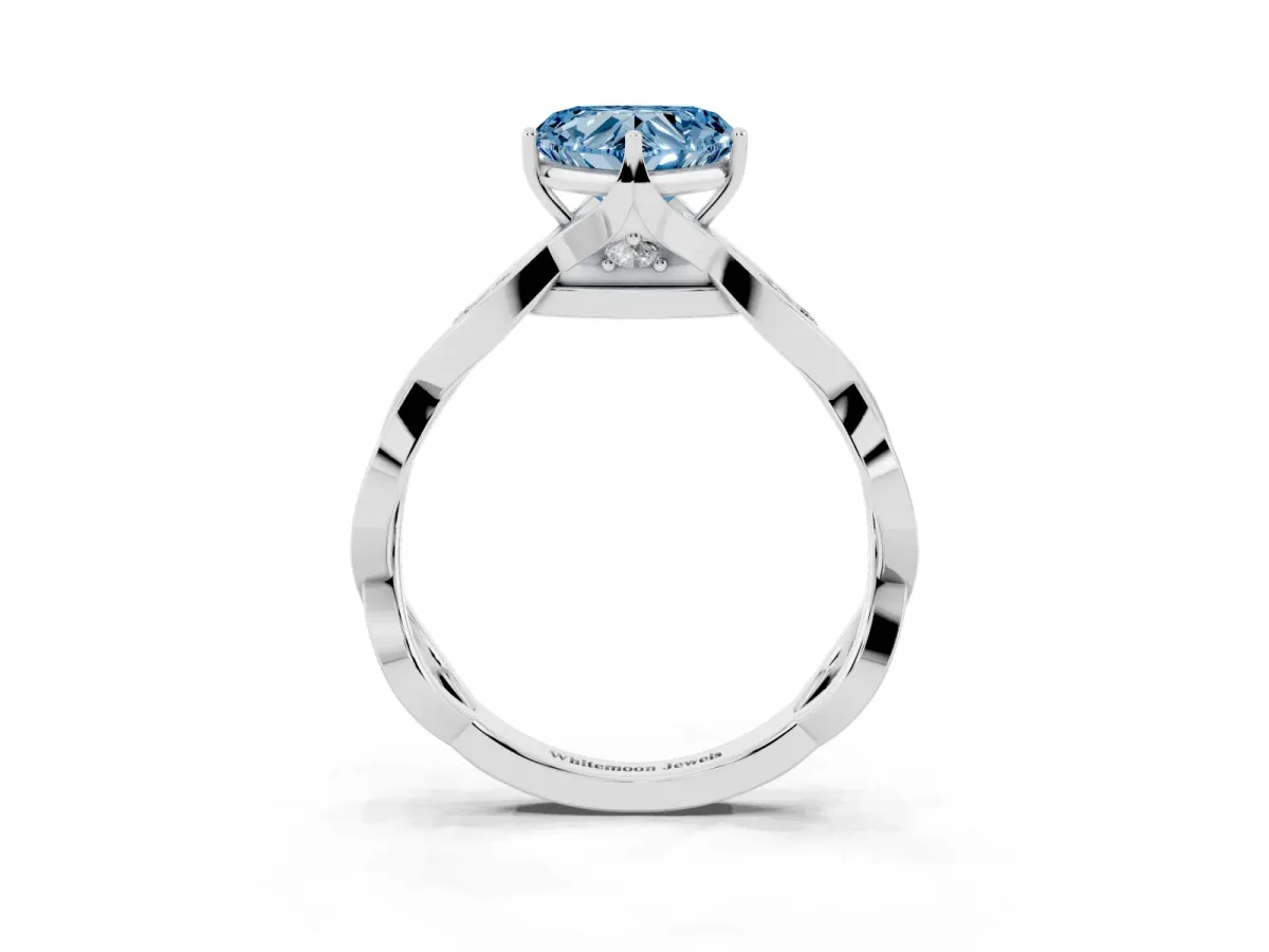 Fancy Blue Heart Cut Solitaire Twist Band with Leaf Prong Setting Platinum