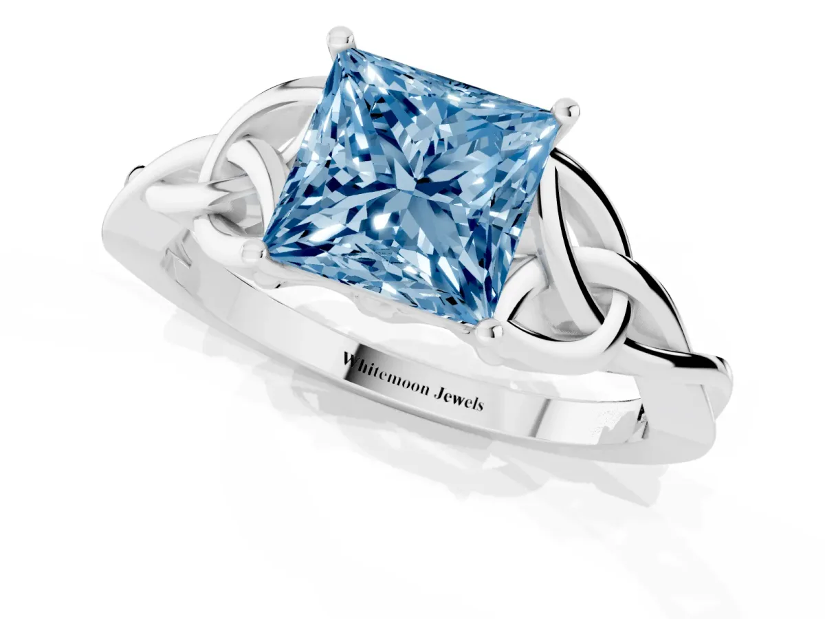 Fancy Blue Princess Cut Diamond Solitaire Engagement Ring with Celtic Knot Band and Four-Prong Setting White gold