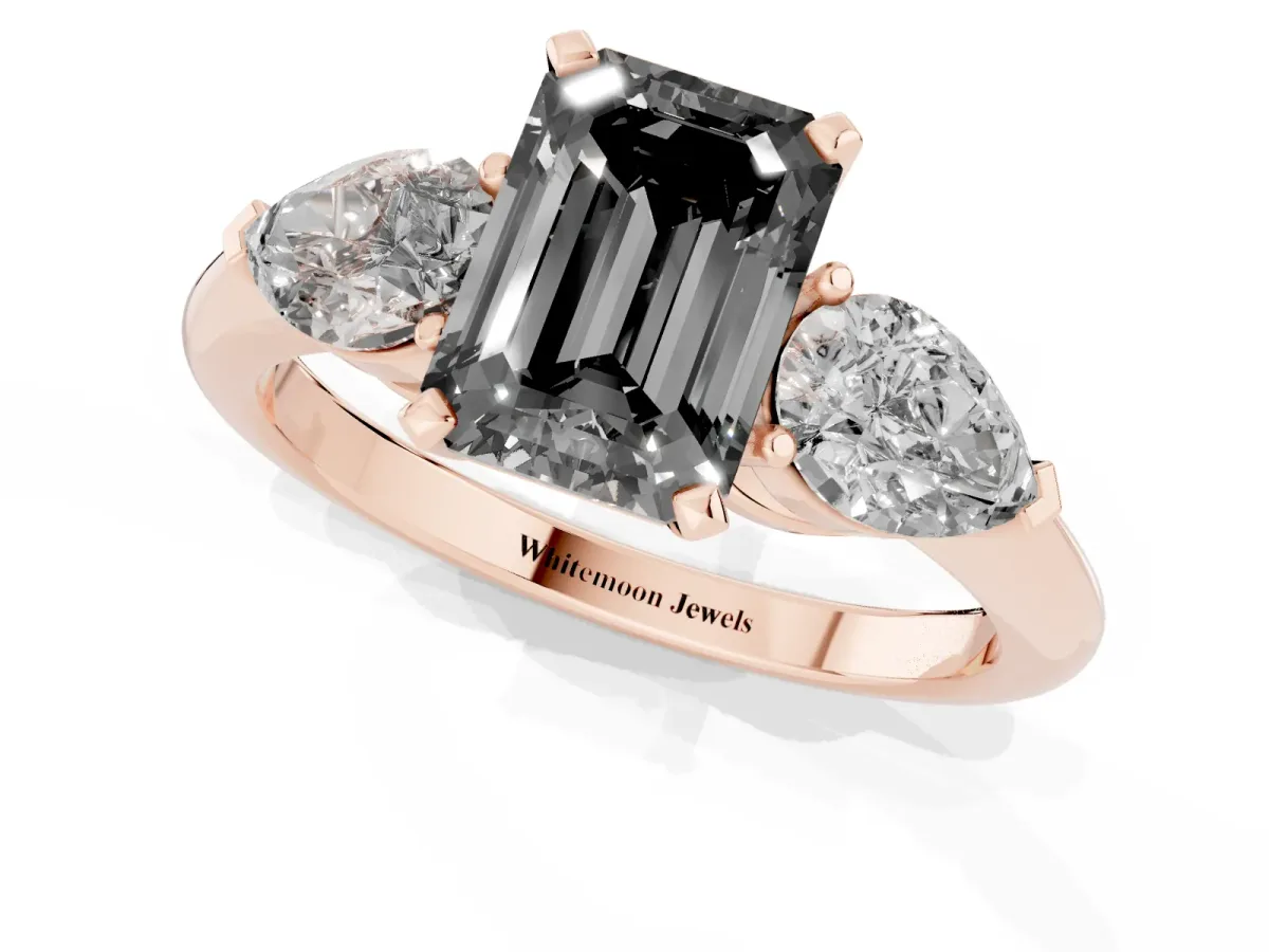 Fancy Black Three-Stone Emerald Cut Diamond Ring with Pear Side Stones and Four-Prong Setting Rose gold