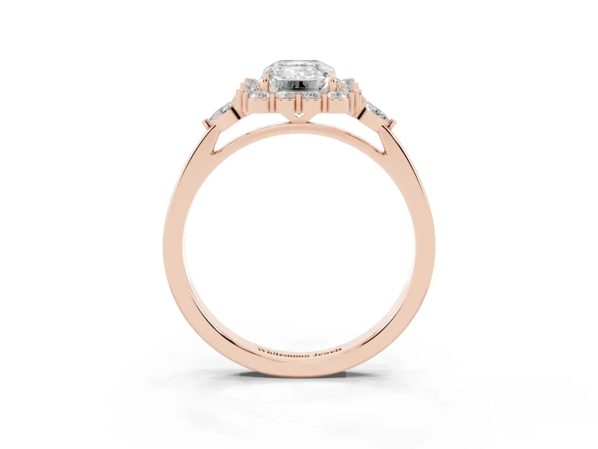 Emerald Cut Diamond Halo Ring with Pear Side Stones and Prong Setting Rose gold