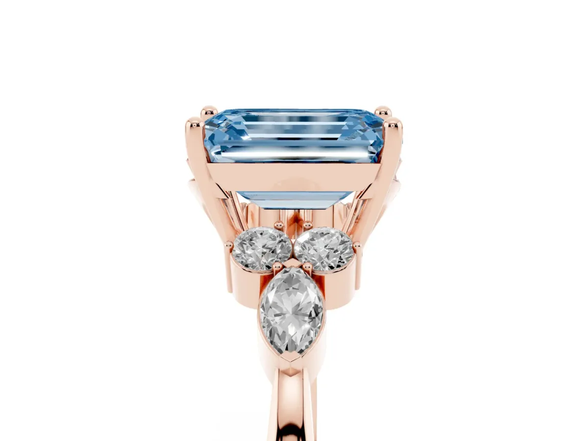 Fancy Blue Emerald Cut Brilliant Diamond Solitaire Ring with Pear Side Stones and Four-Prong Setting Rose gold