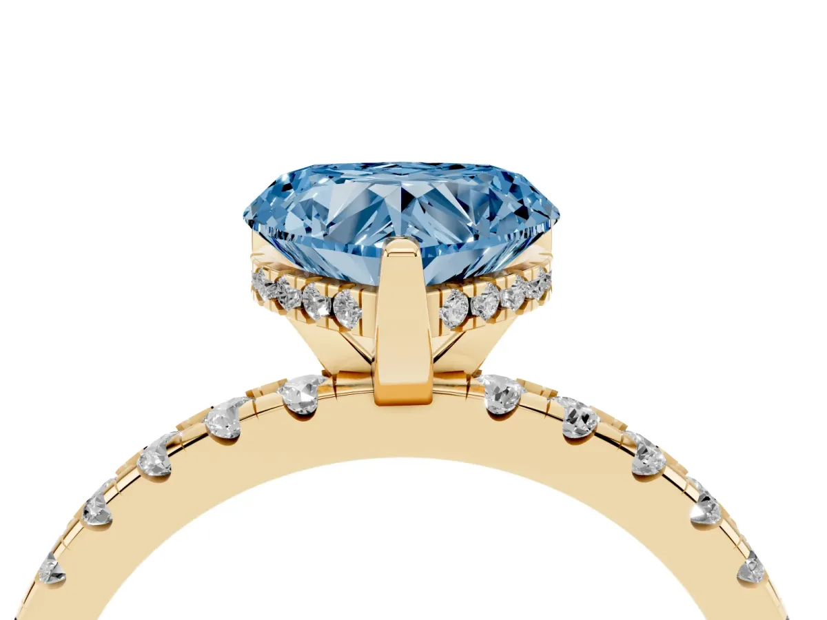Fancy Blue Heart Cut Diamond Solitaire Ring with Round Pavé Band and Four-Prong Setting Yellow gold