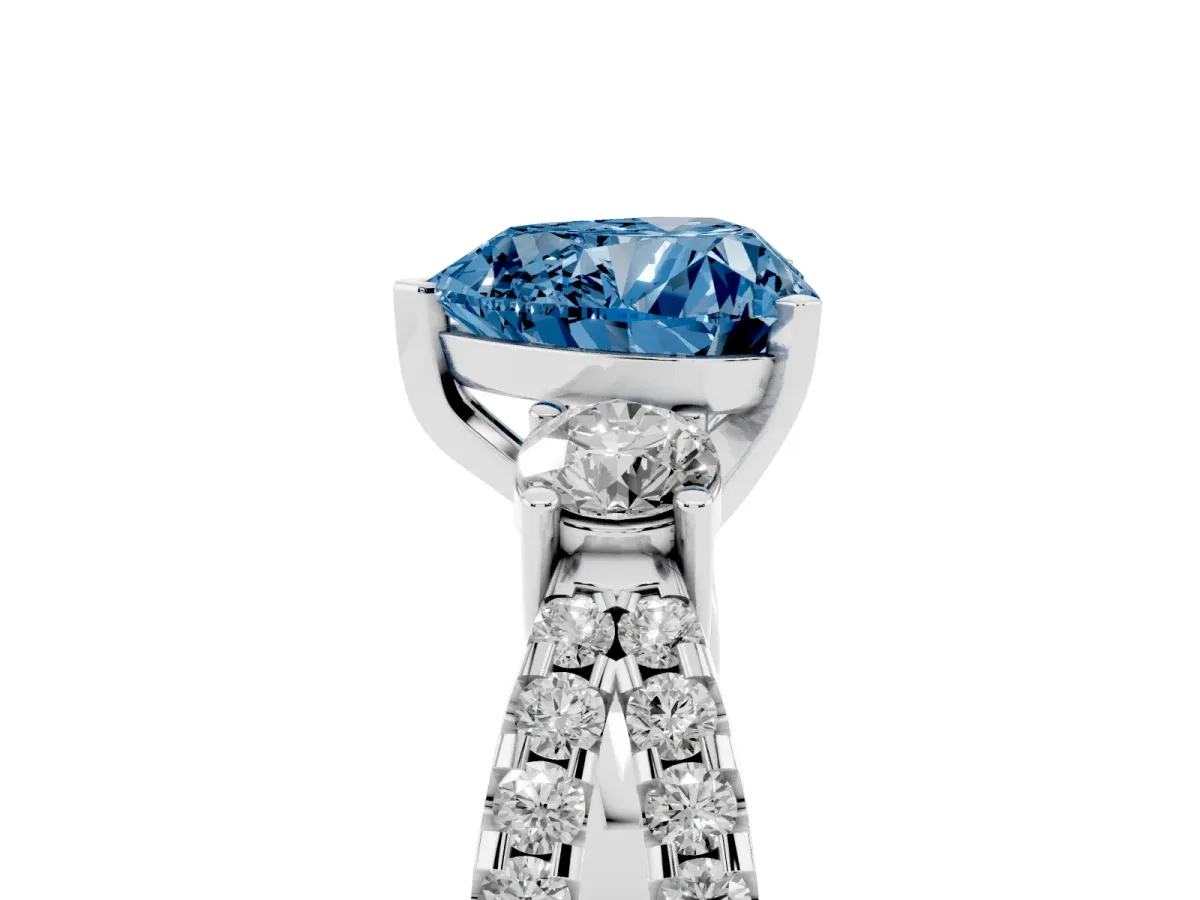 Fancy Blue Heart Cut Diamond Three-Stone Ring with Pavé Split Shank and Four-Prong Setting Silver