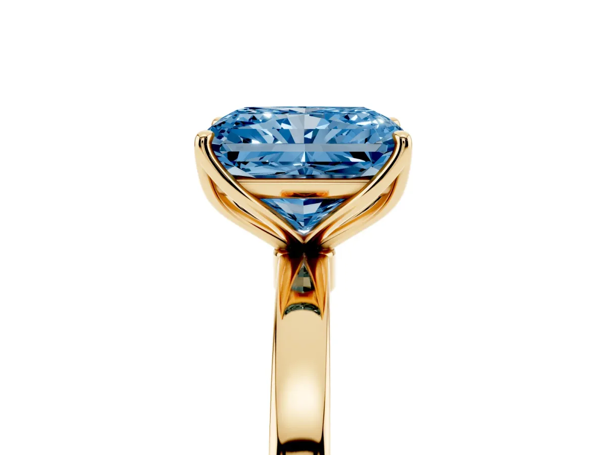 Fancy Blue Radiant Cut Diamond Solitaire Ring with Thin Band and Prong Setting Yellow gold