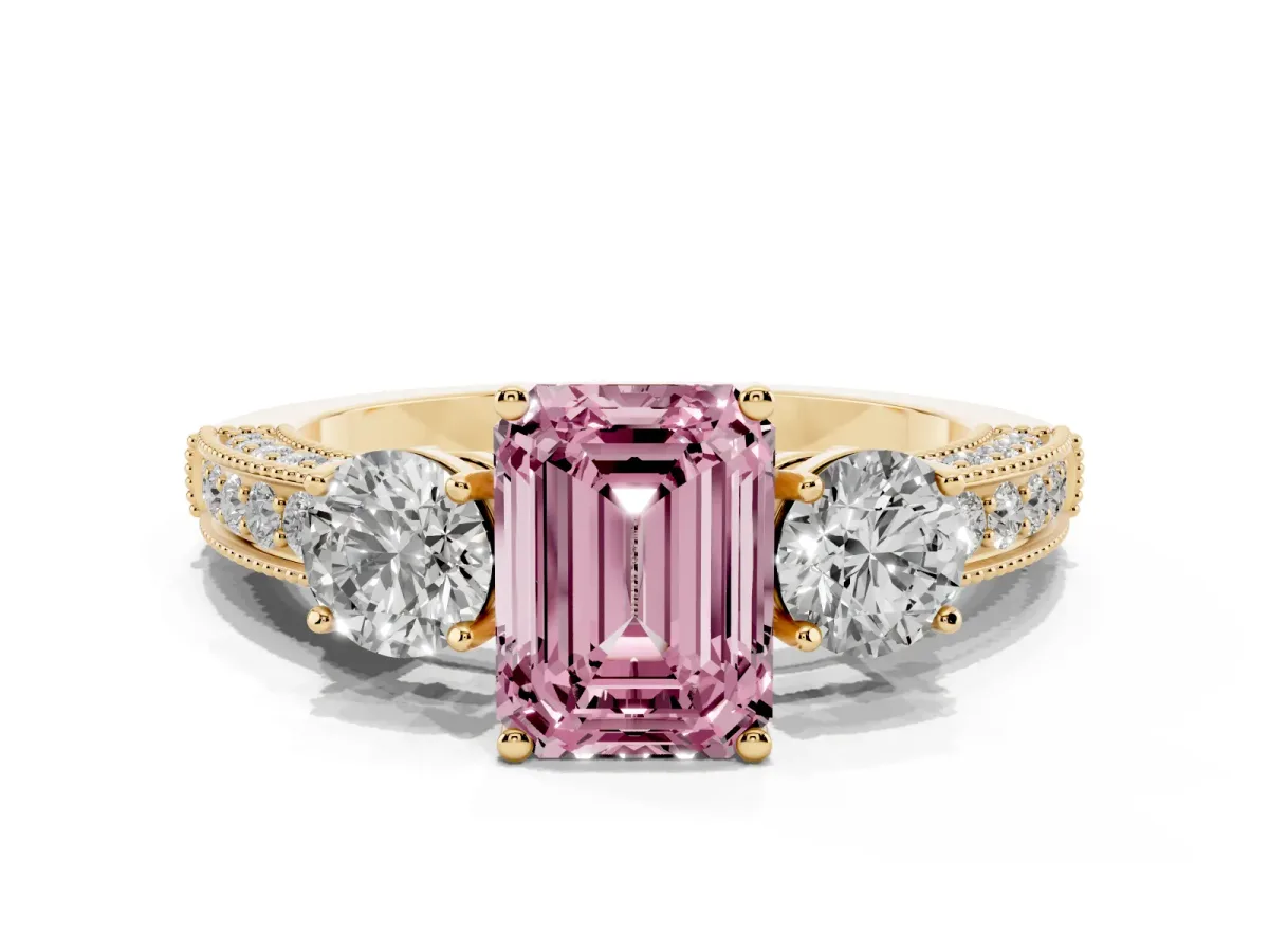 Fancy Pink Emerald Cut Three-Stone Diamond Ring with Pavé Band and Four-Prong Setting Yellow gold