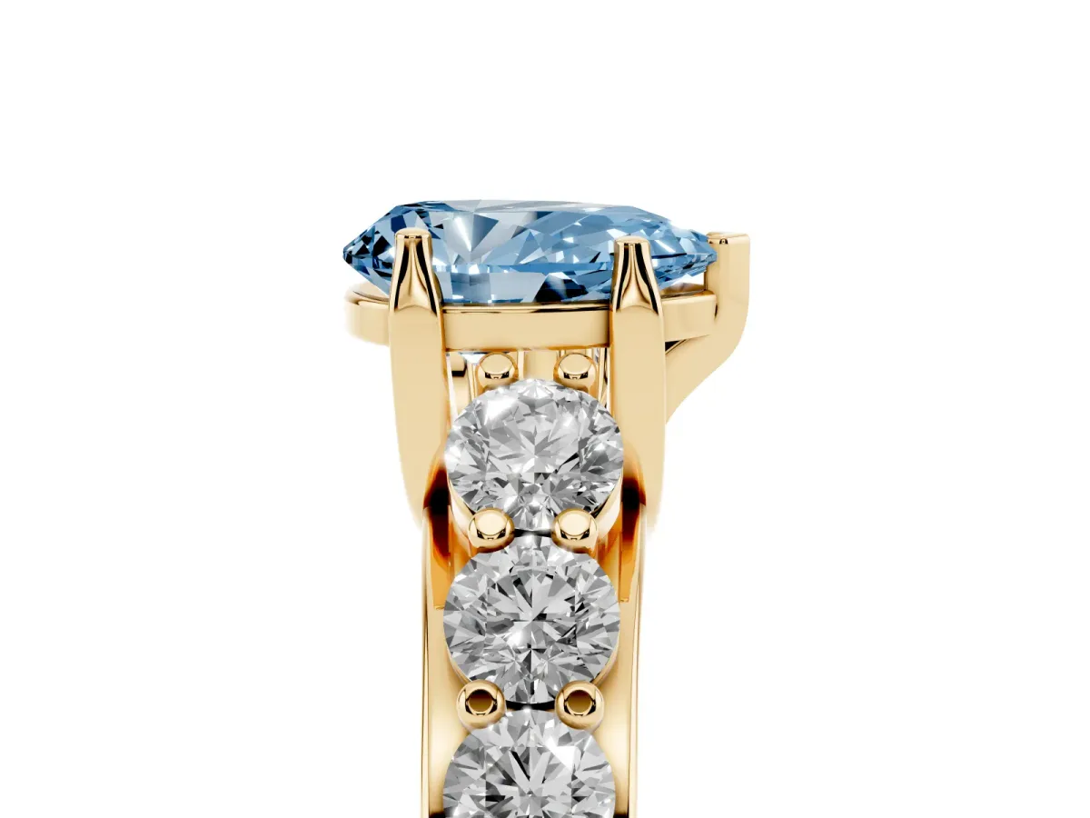 Fancy Blue Pear Cut Diamond Engagement Ring with Pavé Band and Four-Prong Setting Yellow gold