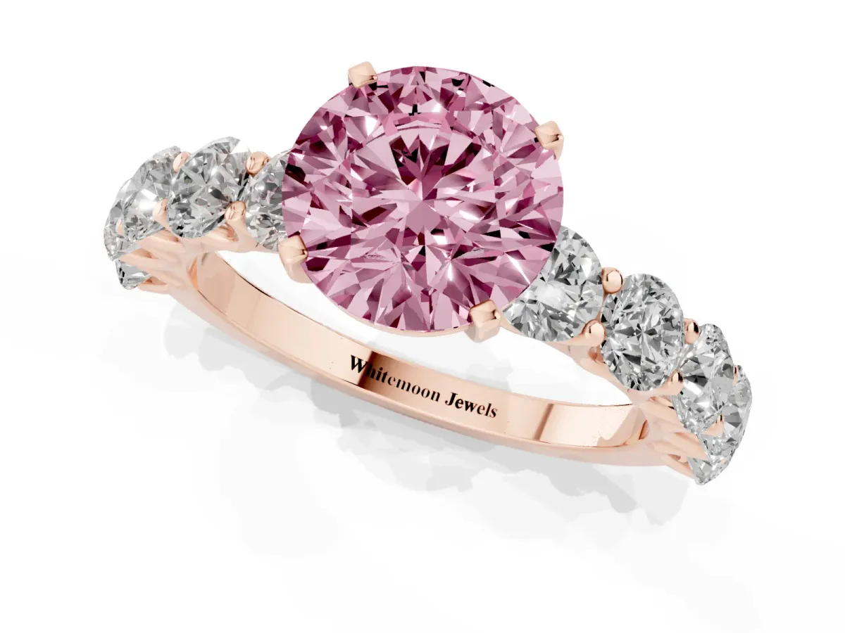 Fancy Pink Round Cut Diamond Prong Setting with Side Stones on a Pave Band Rose gold
